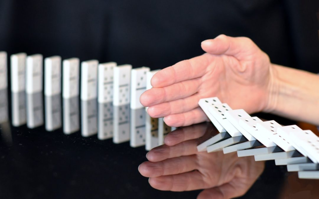 What is Trauma? - Image Depicting Dominoes Falling